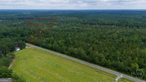 0 Old Louisville Road, Unit LOT 5 Guyton, GA 31312 - Photo 4 of 18 a view of a big yard with lots of green space and mountain view in back