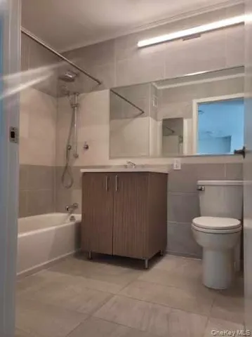 a bathroom with a sink a toilet and bathtub