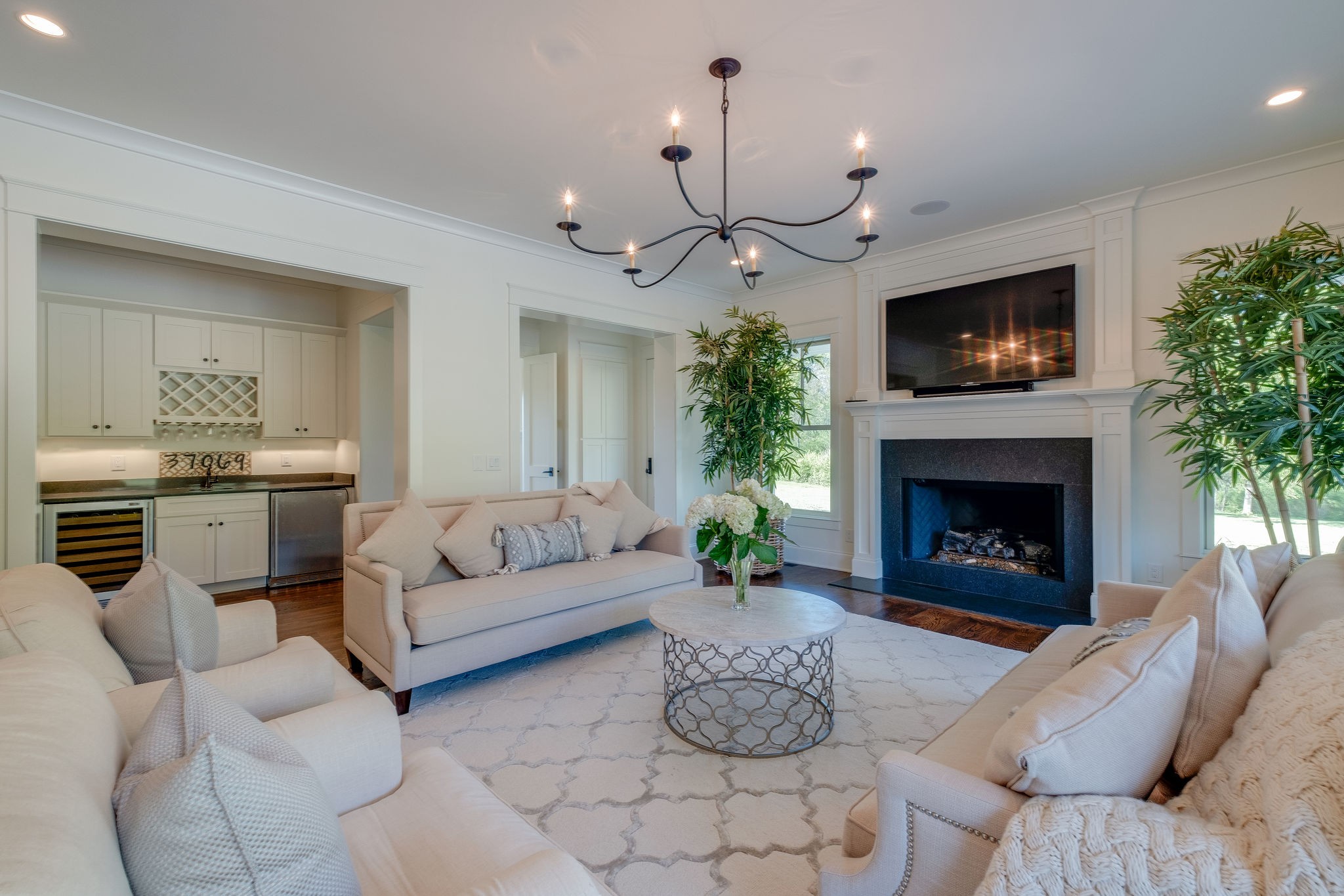 4224 Two Rivers Lane Franklin, TN 37069 - Photo 11 of 50 a living room with furniture a fireplace and a flat screen tv