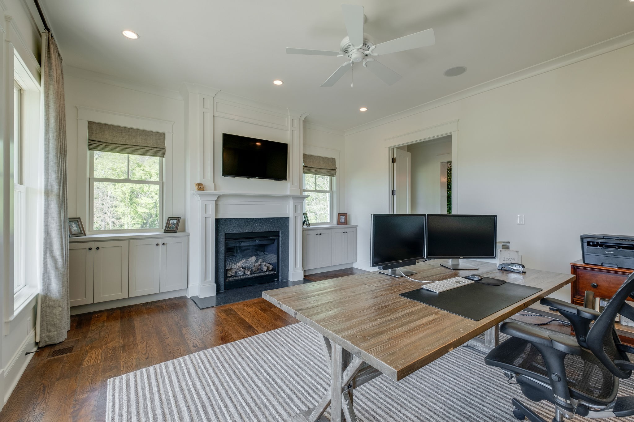 4224 Two Rivers Lane Franklin, TN 37069 - Photo 13 of 50 a living room with a flat screen tv and a fireplace