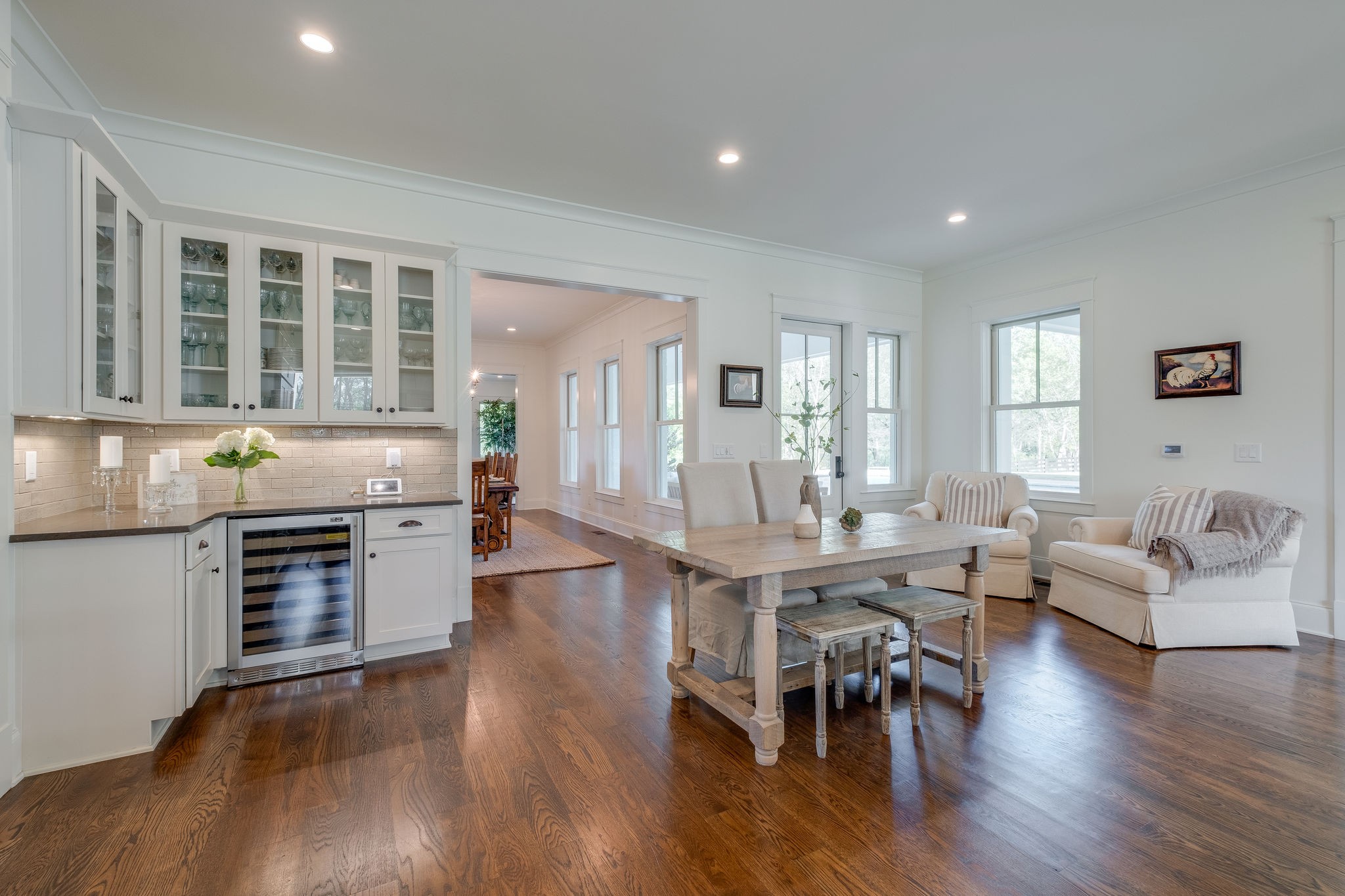 4224 Two Rivers Lane Franklin, TN 37069 - Photo 14 of 50 a living room with stainless steel appliances furniture wooden floor and a kitchen view
