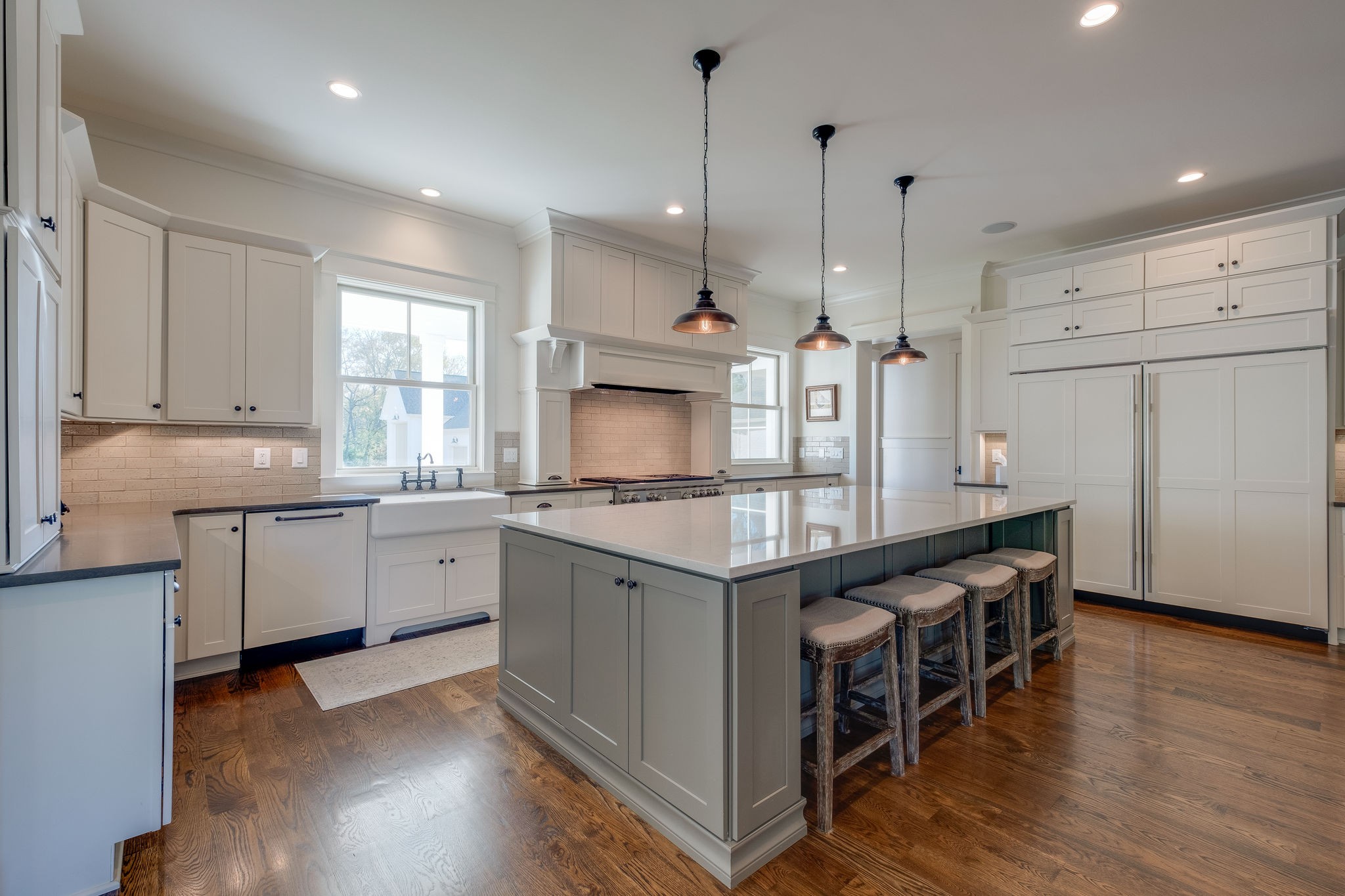 4224 Two Rivers Lane Franklin, TN 37069 - Photo 16 of 50 a kitchen with stainless steel appliances granite countertop a sink a stove a refrigerator and a window