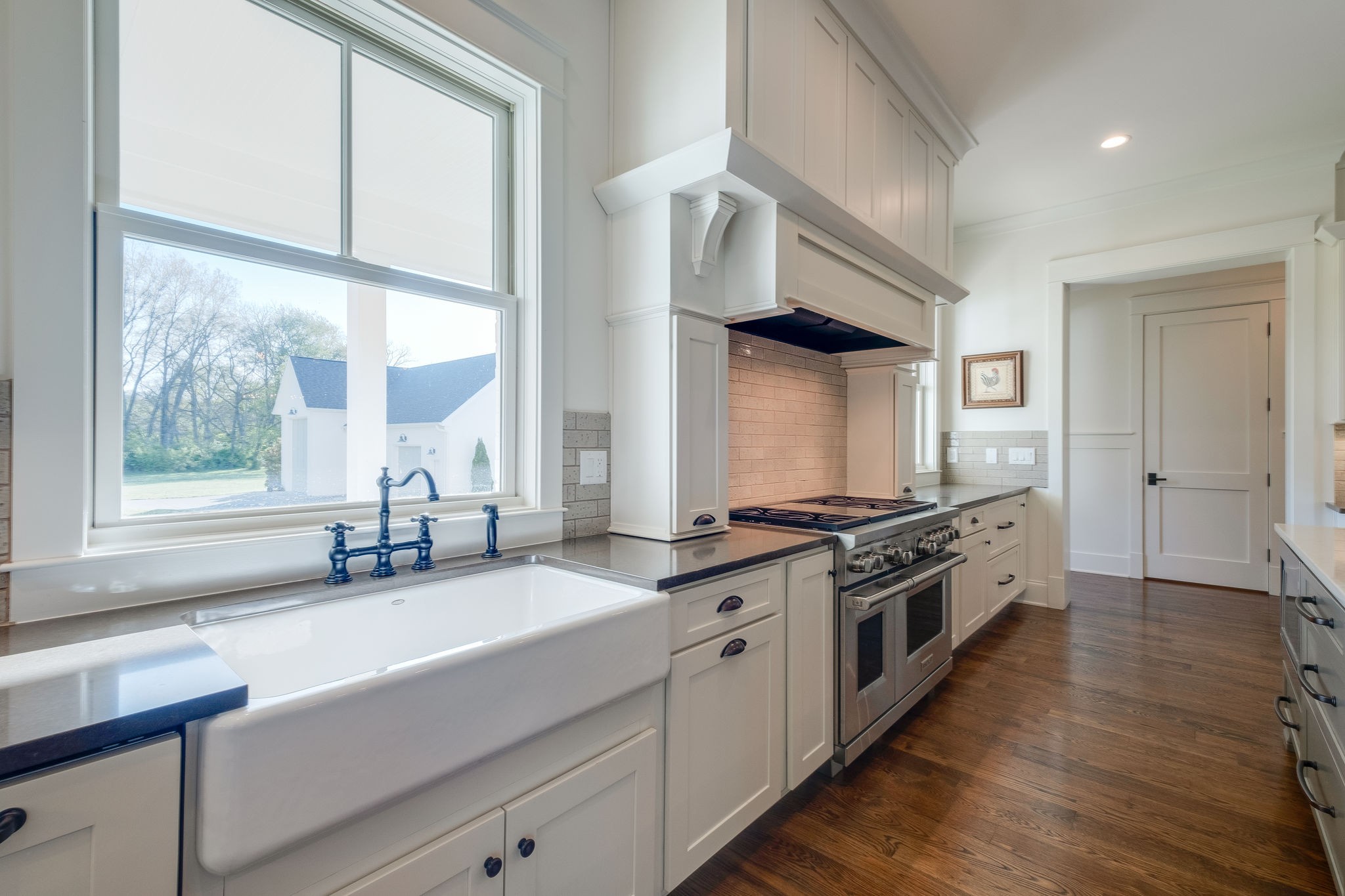 4224 Two Rivers Lane Franklin, TN 37069 - Photo 17 of 50 a kitchen with stainless steel appliances granite countertop a stove and a sink