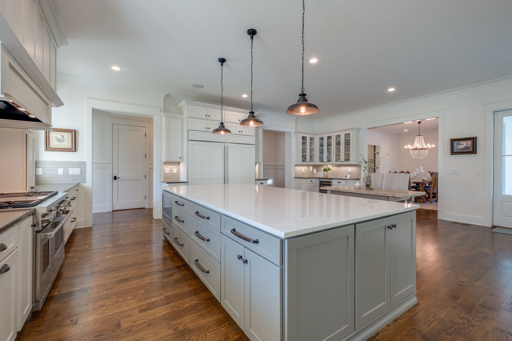 4224 Two Rivers Lane Franklin, TN 37069 - Photo 18 of 50 a kitchen with stainless steel appliances a sink stove and wooden floor