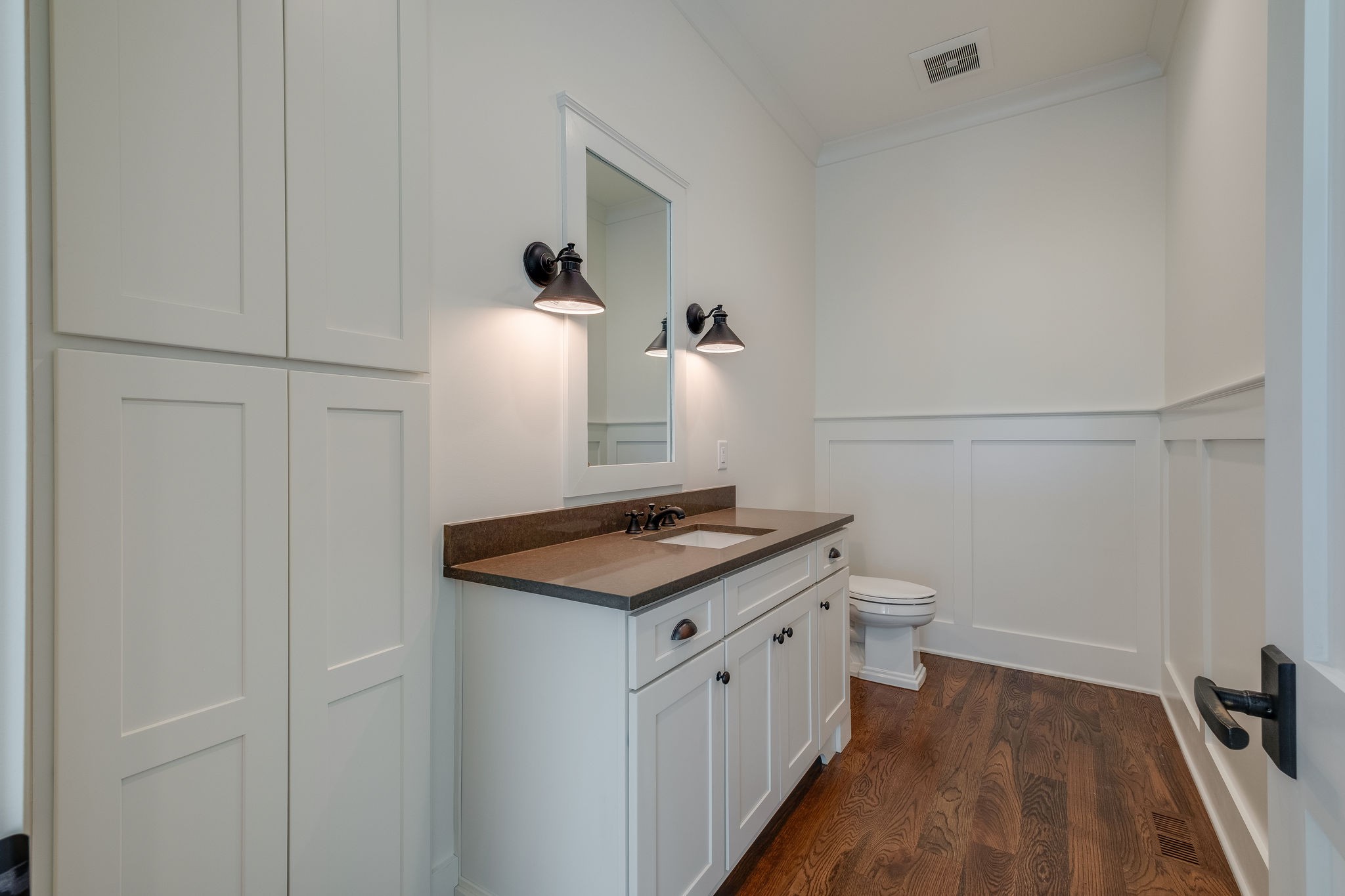 4224 Two Rivers Lane Franklin, TN 37069 - Photo 22 of 50 a bathroom with a granite countertop sink a toilet and a mirror