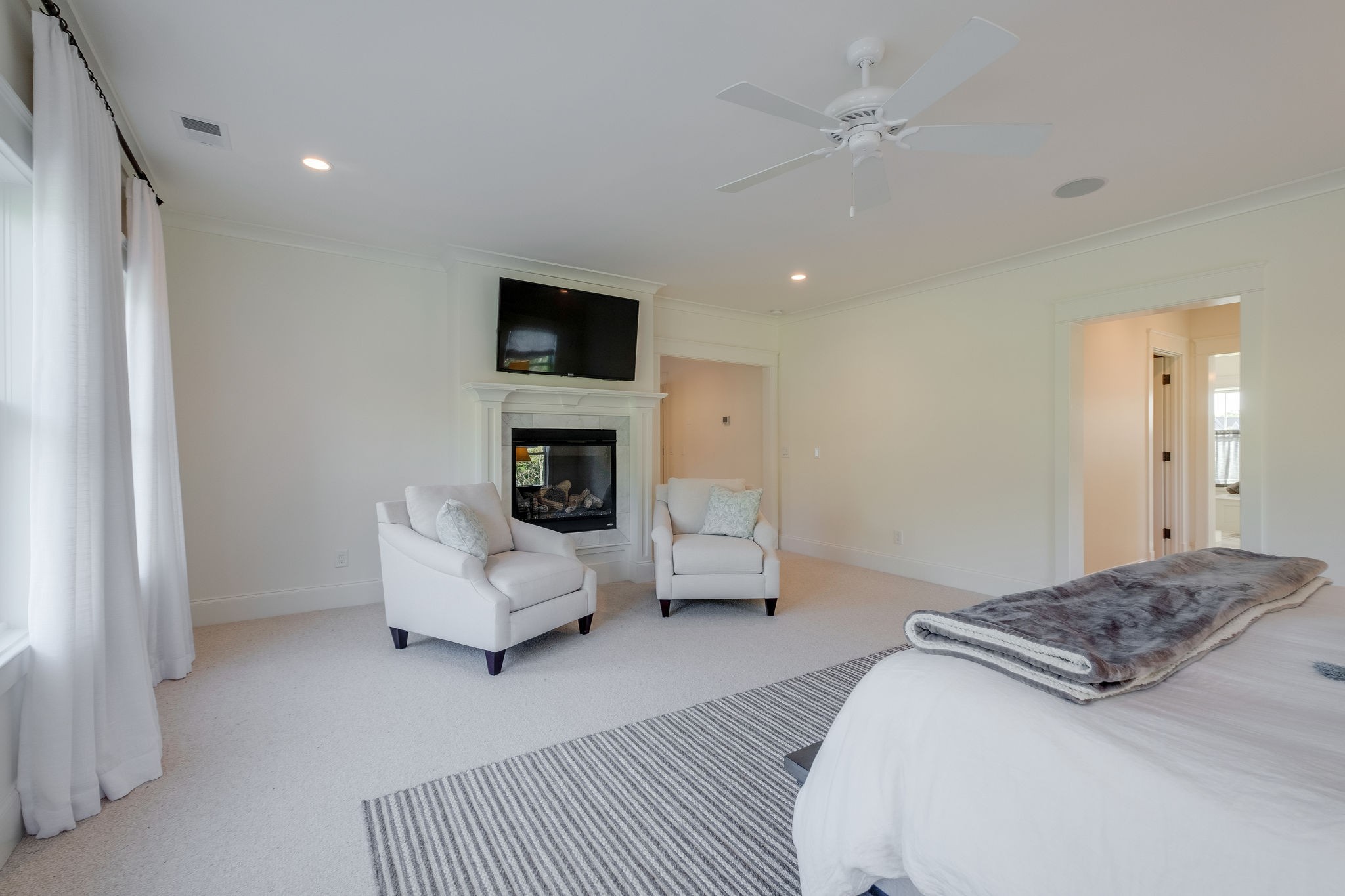 4224 Two Rivers Lane Franklin, TN 37069 - Photo 29 of 50 a spacious bedroom with a bed and a couch
