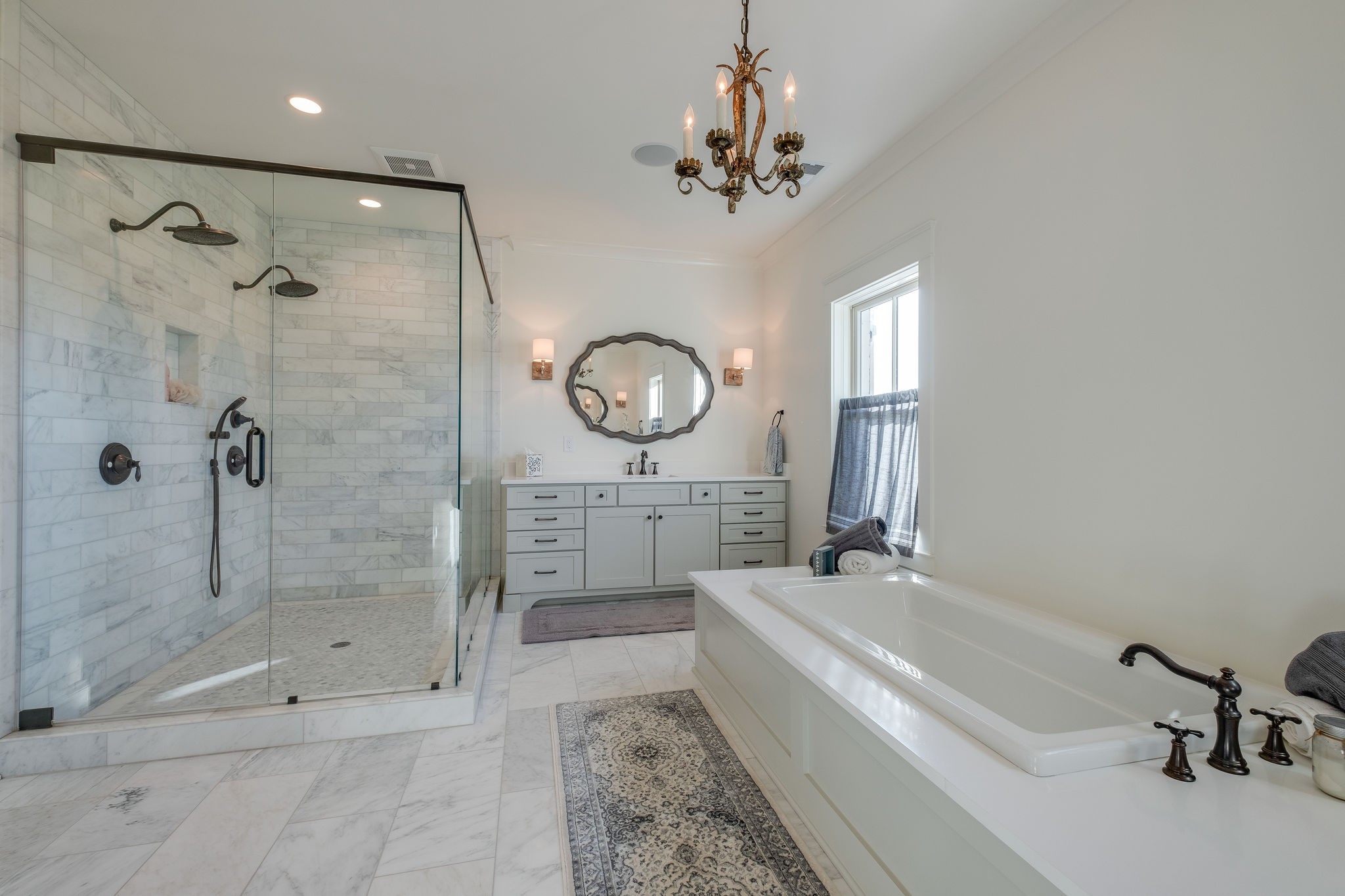 4224 Two Rivers Lane Franklin, TN 37069 - Photo 33 of 50 a bathroom with a tub a sink and a shower