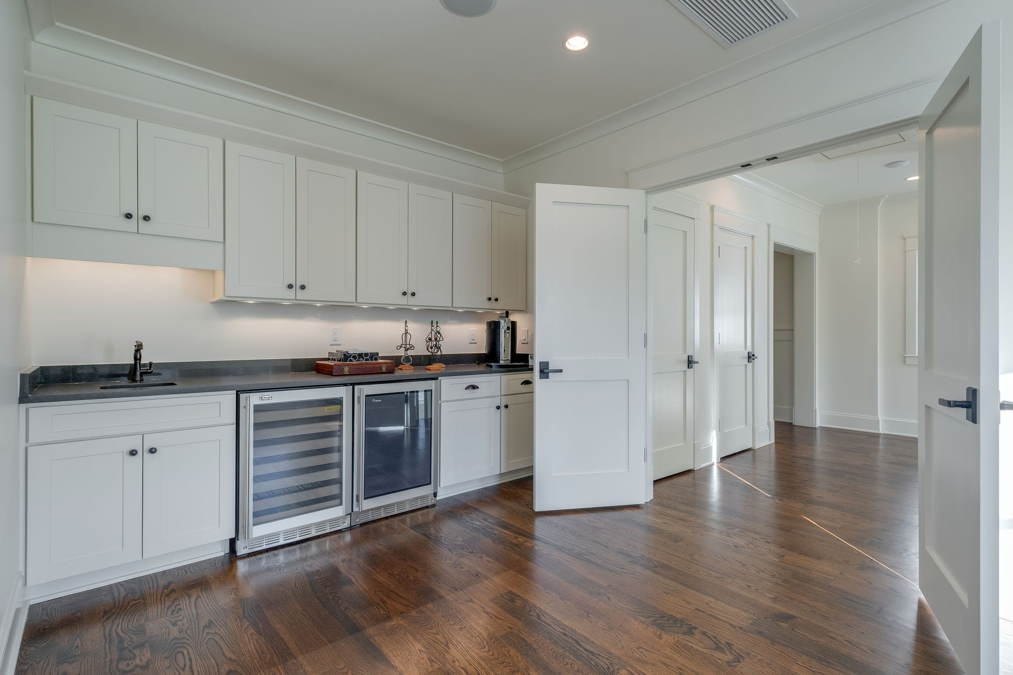 4224 Two Rivers Lane Franklin, TN 37069 - Photo 36 of 50 a kitchen with granite countertop white cabinets and stainless steel appliances