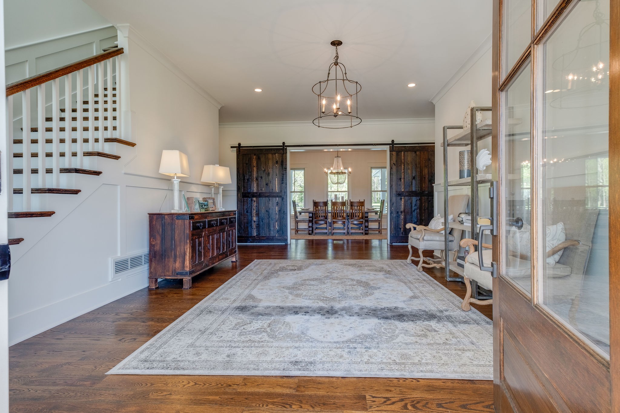 4224 Two Rivers Lane Franklin, TN 37069 - Photo 7 of 50 a view of a kitchen with dining table and chandelier
