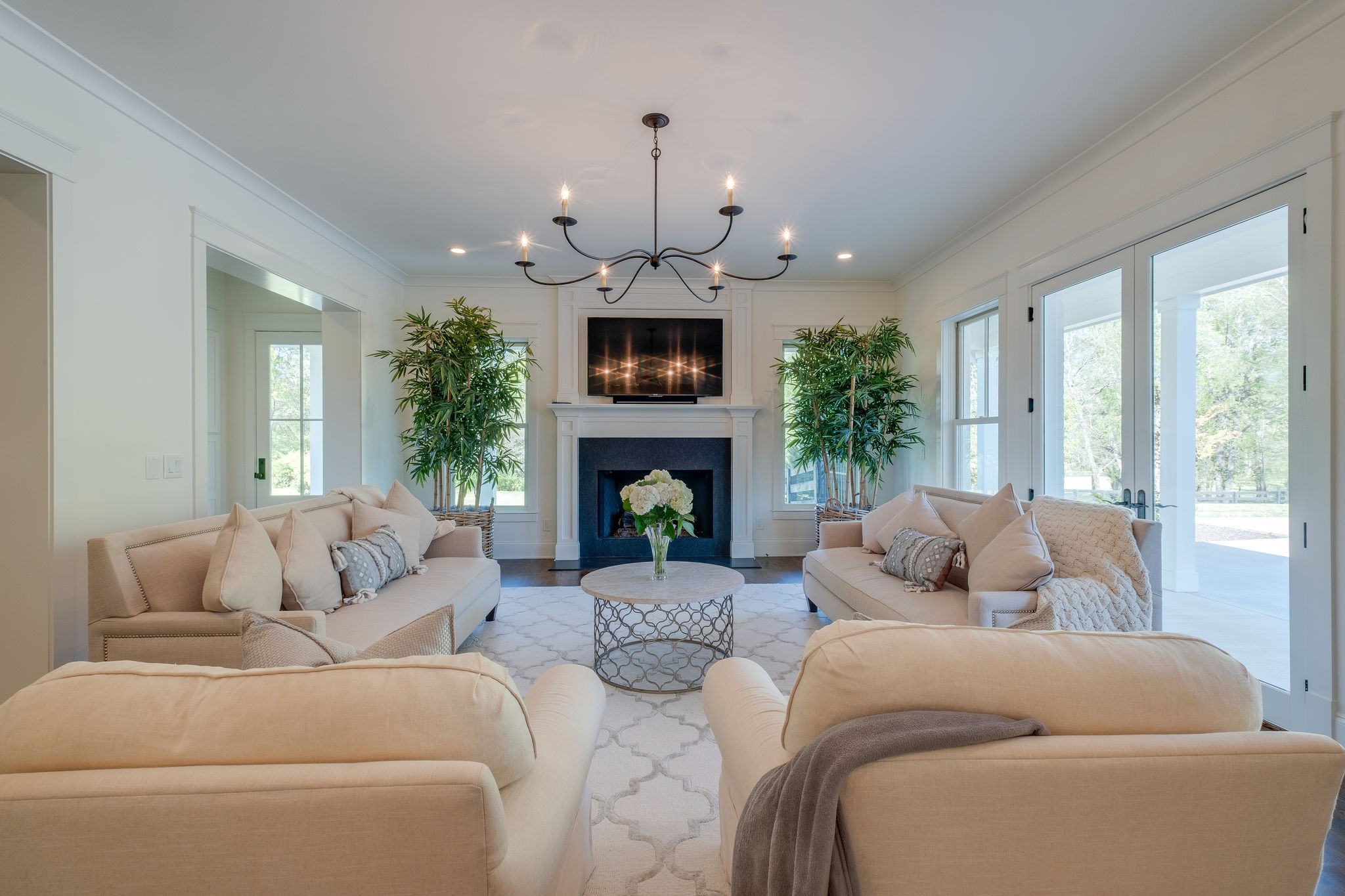 4224 Two Rivers Lane Franklin, TN 37069 - Photo 10 of 50 a living room with furniture a fireplace and a large window