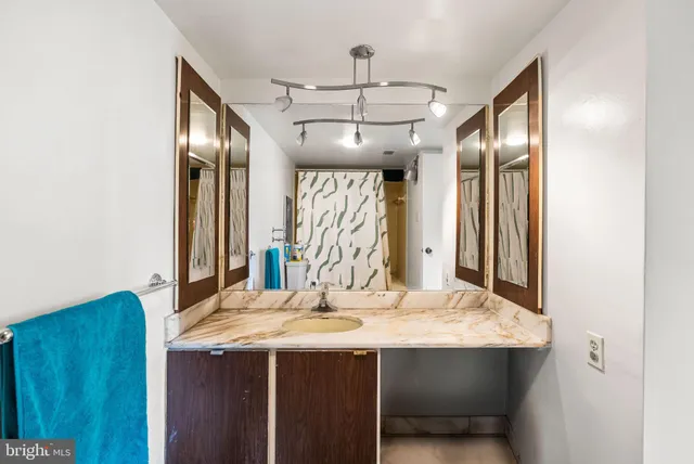 a bathroom with a sink and a mirror