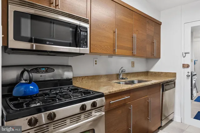 a kitchen with a stove and a microwave