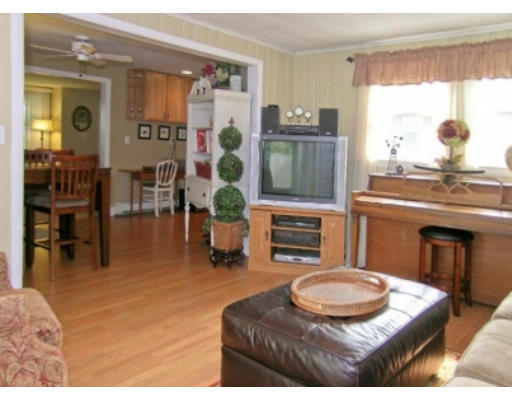 4 Wedgewood Road Natick, MA 01760 - Photo 3 of 6 a living room with furniture and a fireplace