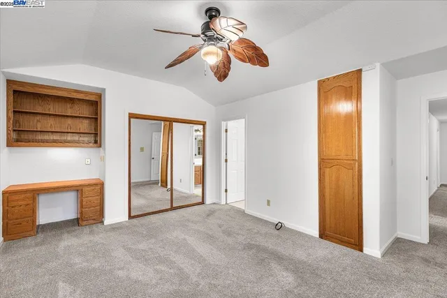 a spacious bathroom with a double vanity sink and a mirror