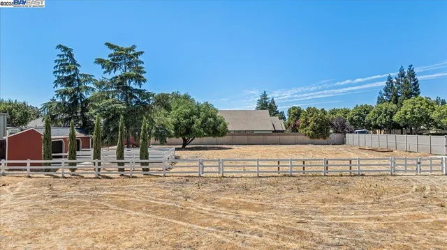 a view of a swimming pool with a yard