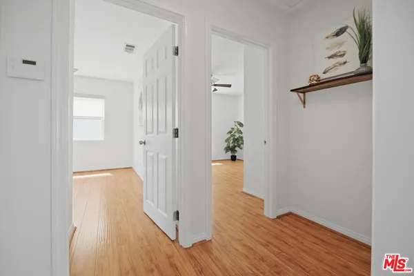 wooden floor with white walls