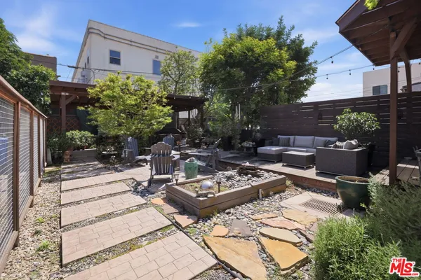 a view of a backyard with sitting area