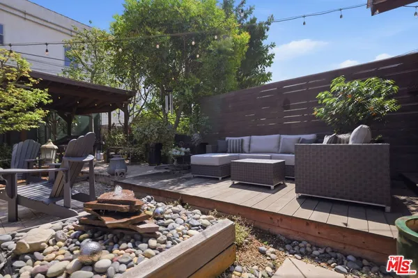 a view of a backyard with sitting area