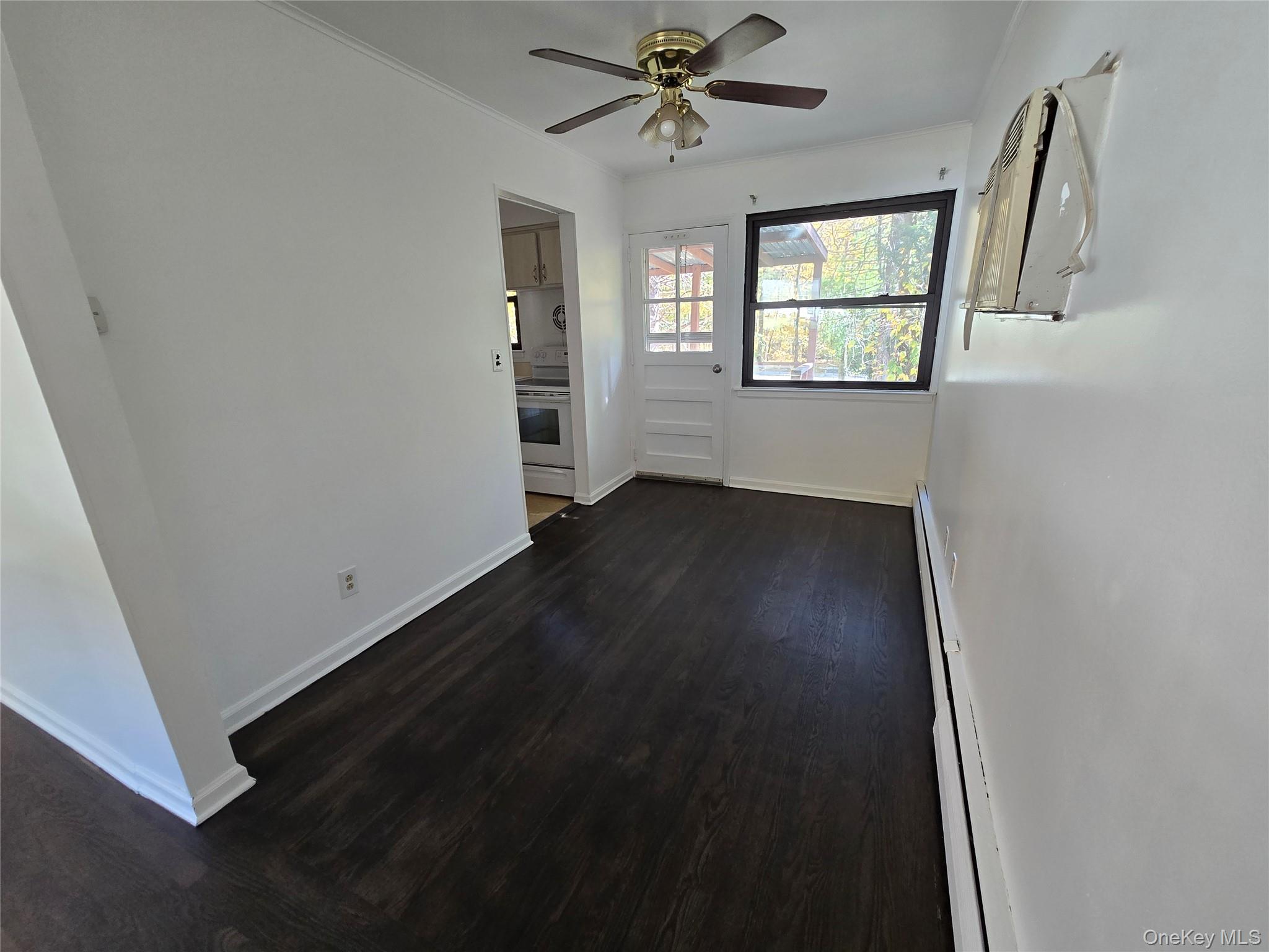 24 Oakbrook Road Ossining, NY 10562 - Photo 7 of 17 an empty room with wooden floor fan and windows