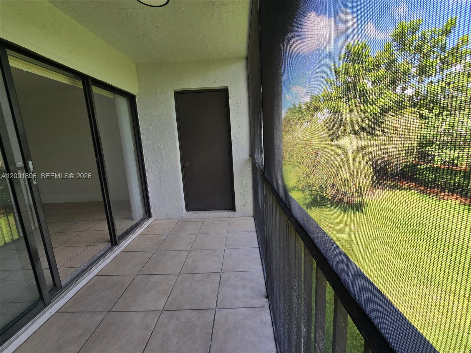310 Racquet Club Road, Unit 204 Weston, FL 33326 - Photo 31 of 34 Balcony and Storage Garden View