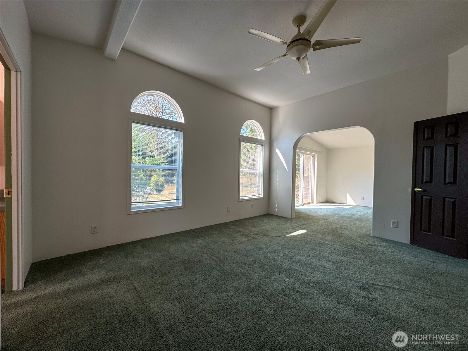 773 Lucas Creek Road Chehalis, WA 98532 - Photo 11 of 37 an empty room with windows and fan