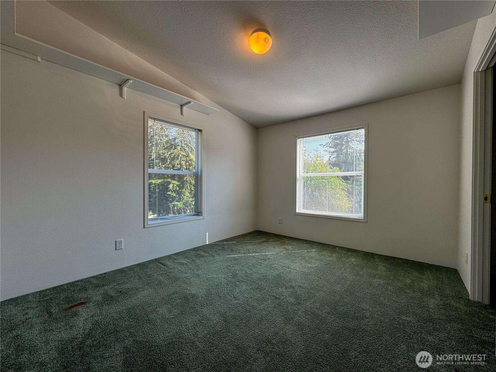 773 Lucas Creek Road Chehalis, WA 98532 - Photo 16 of 37 an empty room with windows and mirror
