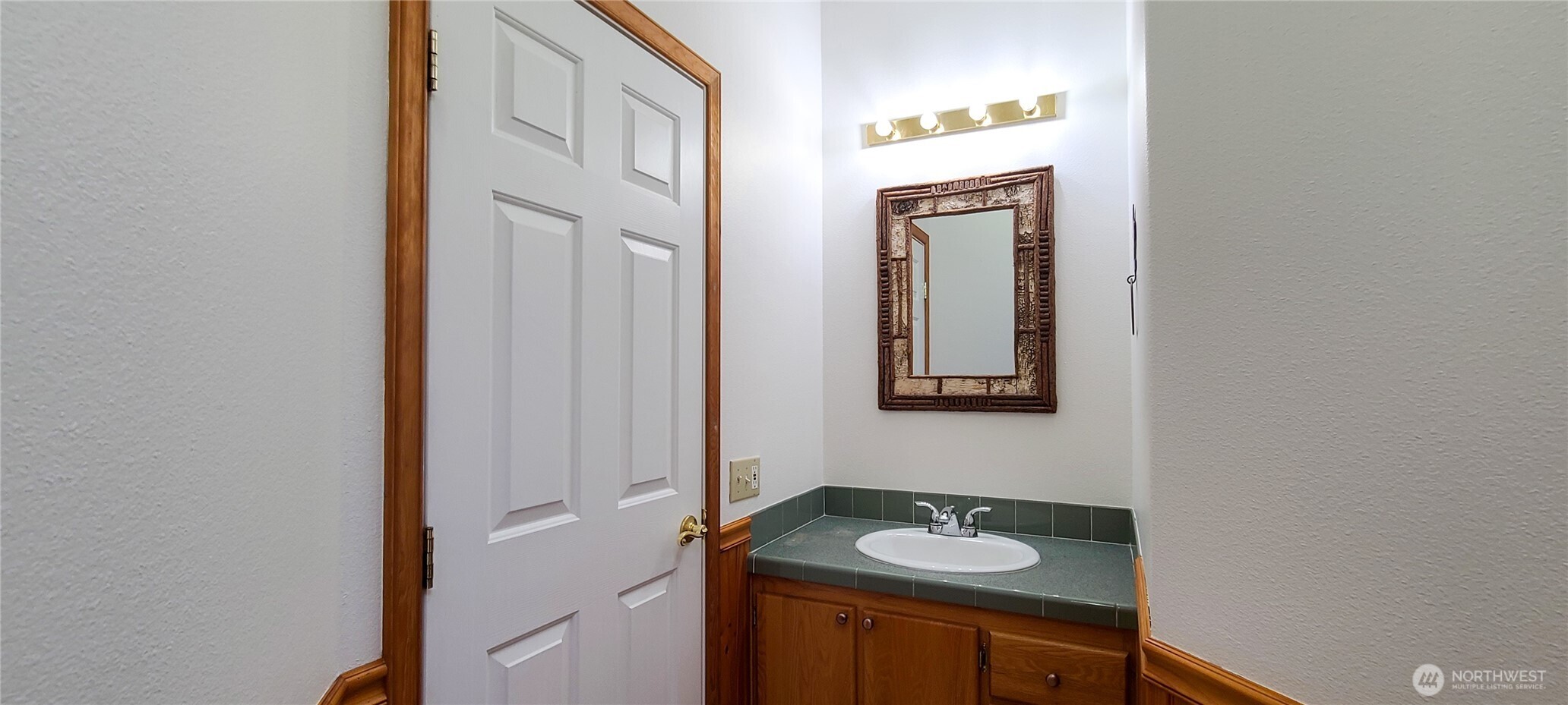 773 Lucas Creek Road Chehalis, WA 98532 - Photo 24 of 40 a bathroom with a granite countertop sink and a mirror