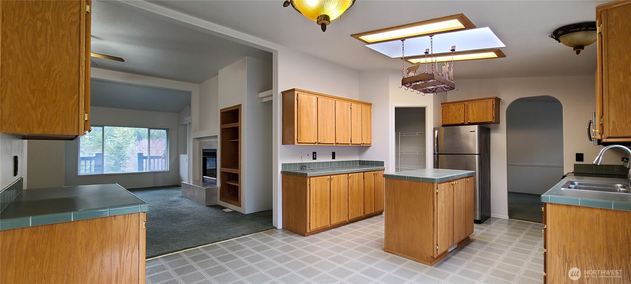 773 Lucas Creek Road Chehalis, WA 98532 - Photo 4 of 40 a kitchen with stainless steel appliances granite countertop a refrigerator a stove and a sink