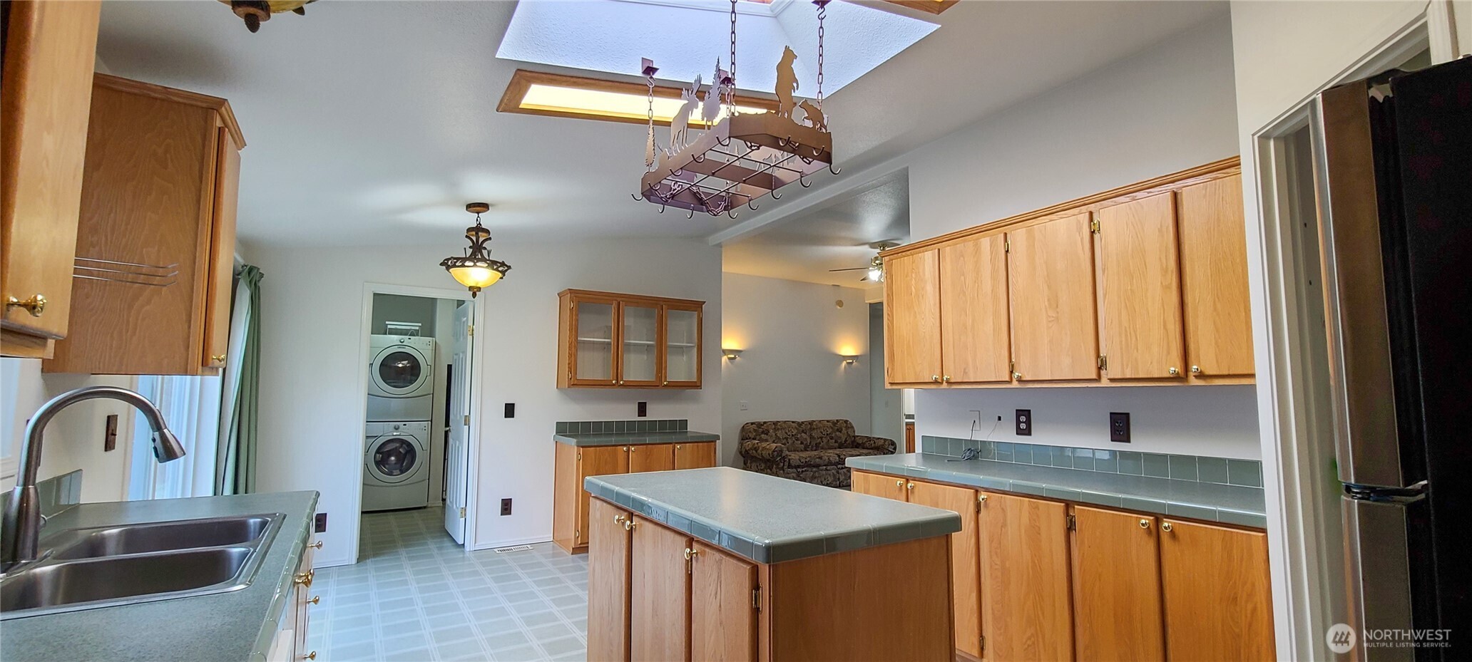 773 Lucas Creek Road Chehalis, WA 98532 - Photo 6 of 40 a kitchen with stainless steel appliances granite countertop a sink a stove cabinets and a dining table