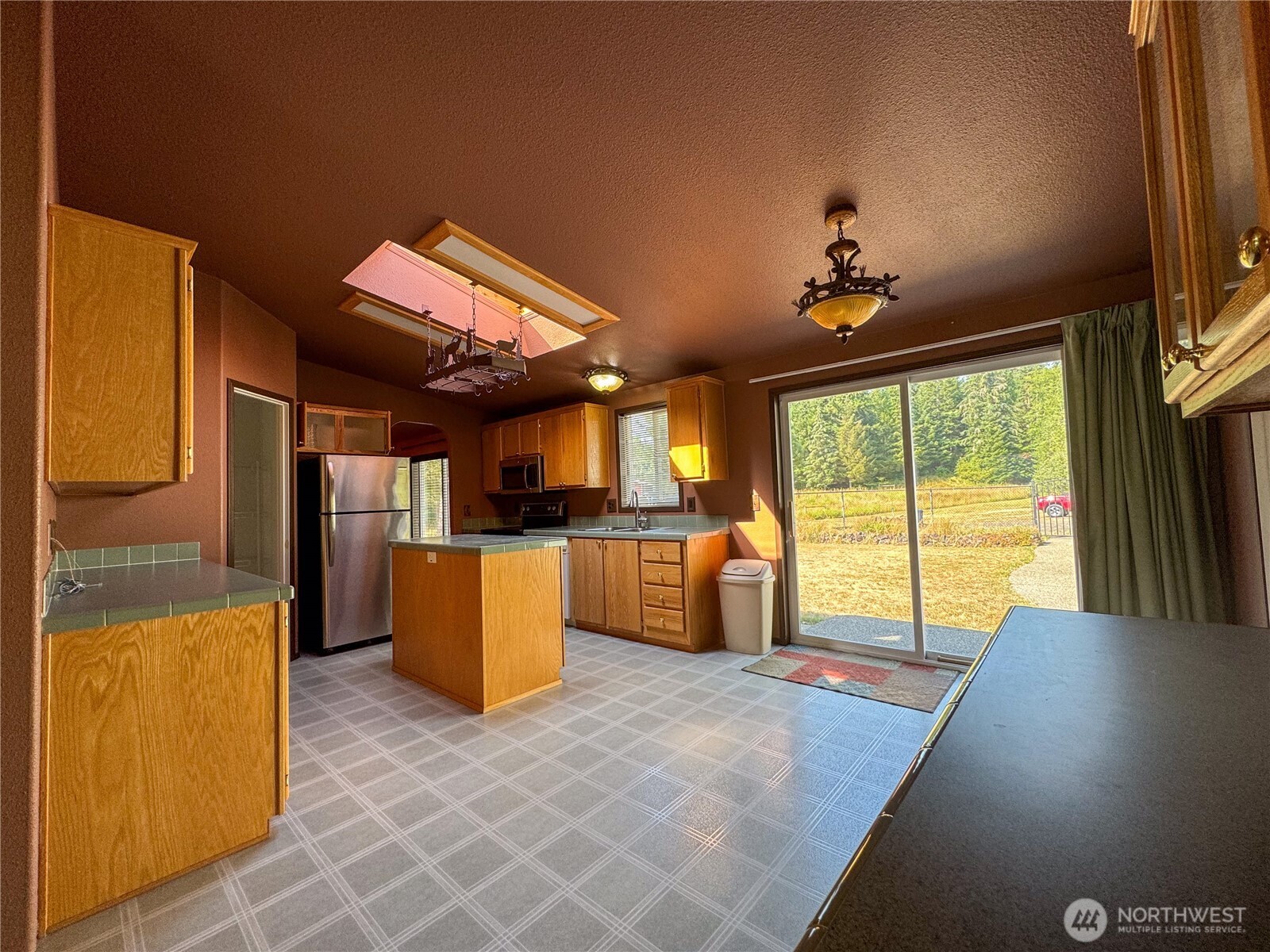 773 Lucas Creek Road Chehalis, WA 98532 - Photo 6 of 37 a view of a living room with furniture and a flat screen tv