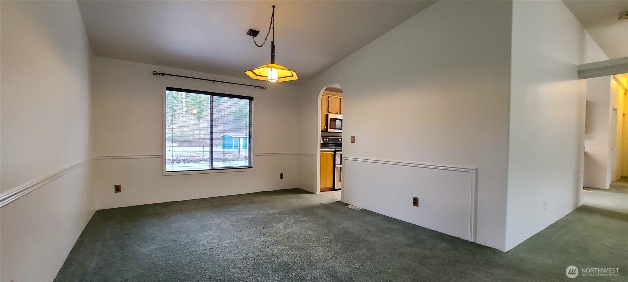 773 Lucas Creek Road Chehalis, WA 98532 - Photo 8 of 40 an empty room with windows and ceiling fan