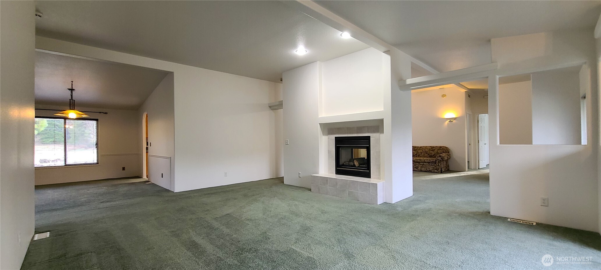 773 Lucas Creek Road Chehalis, WA 98532 - Photo 10 of 40 an empty room with windows and fireplace