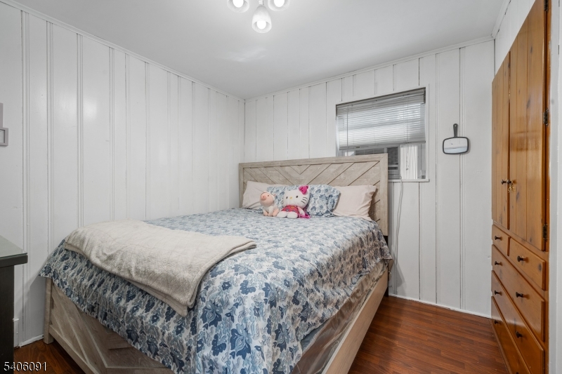 460 Grove Street Rahway, NJ 07065 - Photo 17 of 26 a bedroom with a bed and a mirror