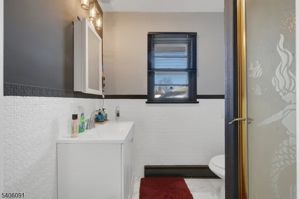a bathroom with a sink and a toilet