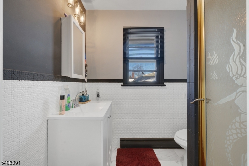 460 Grove Street Rahway, NJ 07065 - Photo 23 of 26 a bathroom with a sink and a toilet
