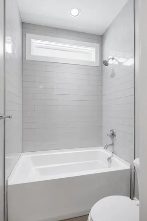 a bathroom with a sink a toilet and a bathtub