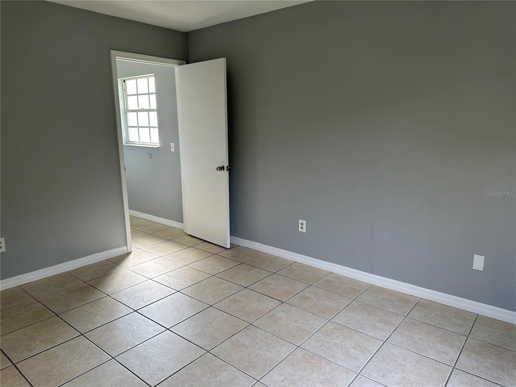 425 Ricold Terrace Port Charlotte, FL 33954 - Photo 6 of 10 a view of an empty room and window