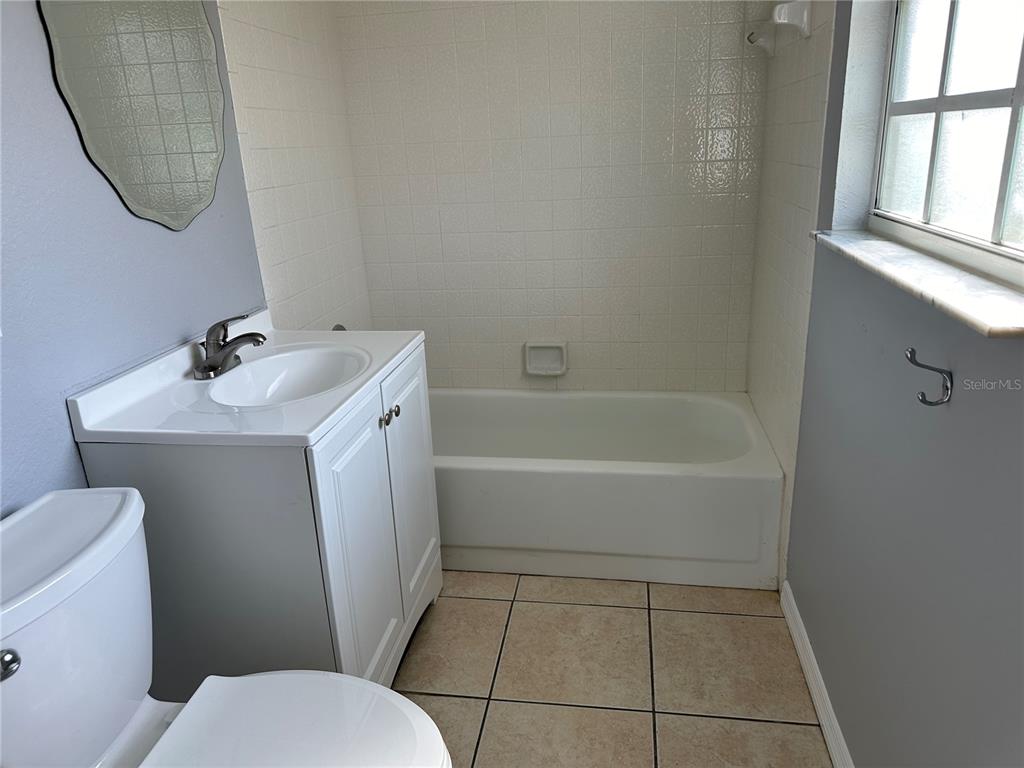425 Ricold Terrace Port Charlotte, FL 33954 - Photo 7 of 10 a bathroom with a sink toilet and tub