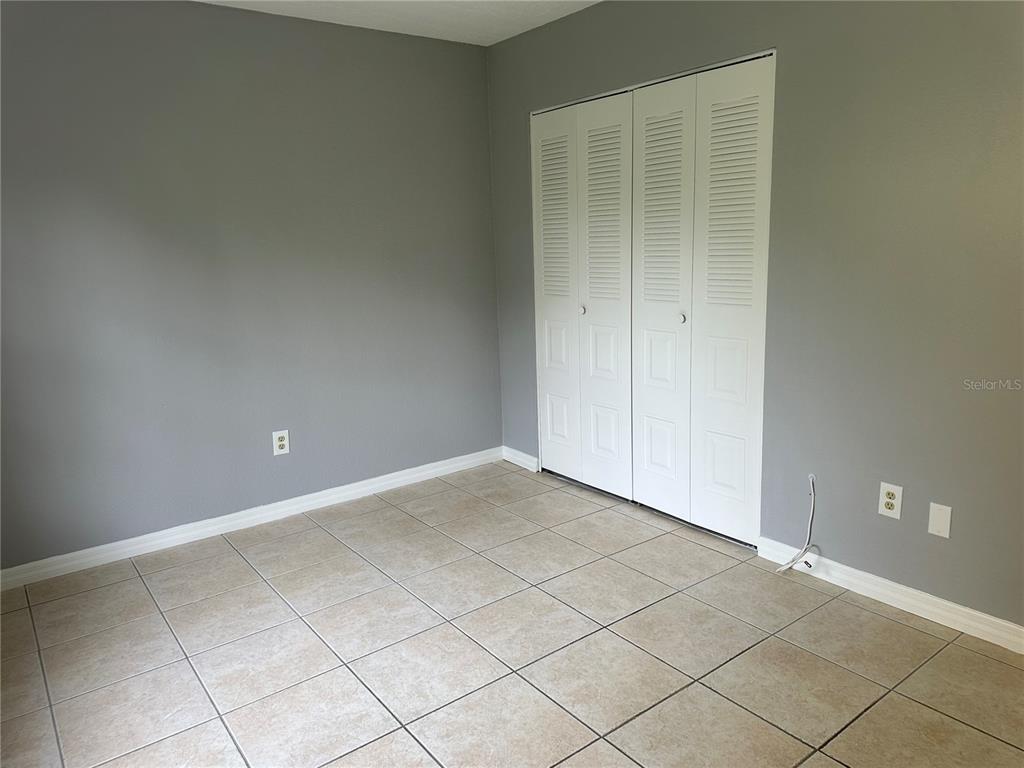 425 Ricold Terrace Port Charlotte, FL 33954 - Photo 8 of 10 an empty room with a empty space and windows