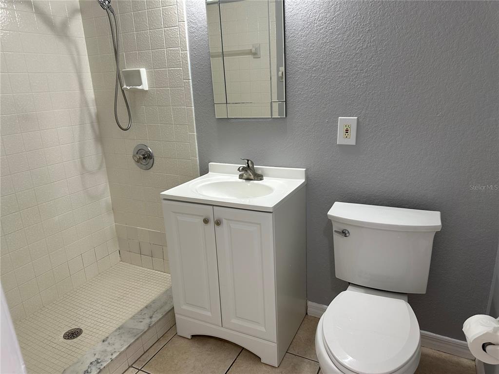 425 Ricold Terrace Port Charlotte, FL 33954 - Photo 10 of 10 a white toilet sitting next to a bathroom sink