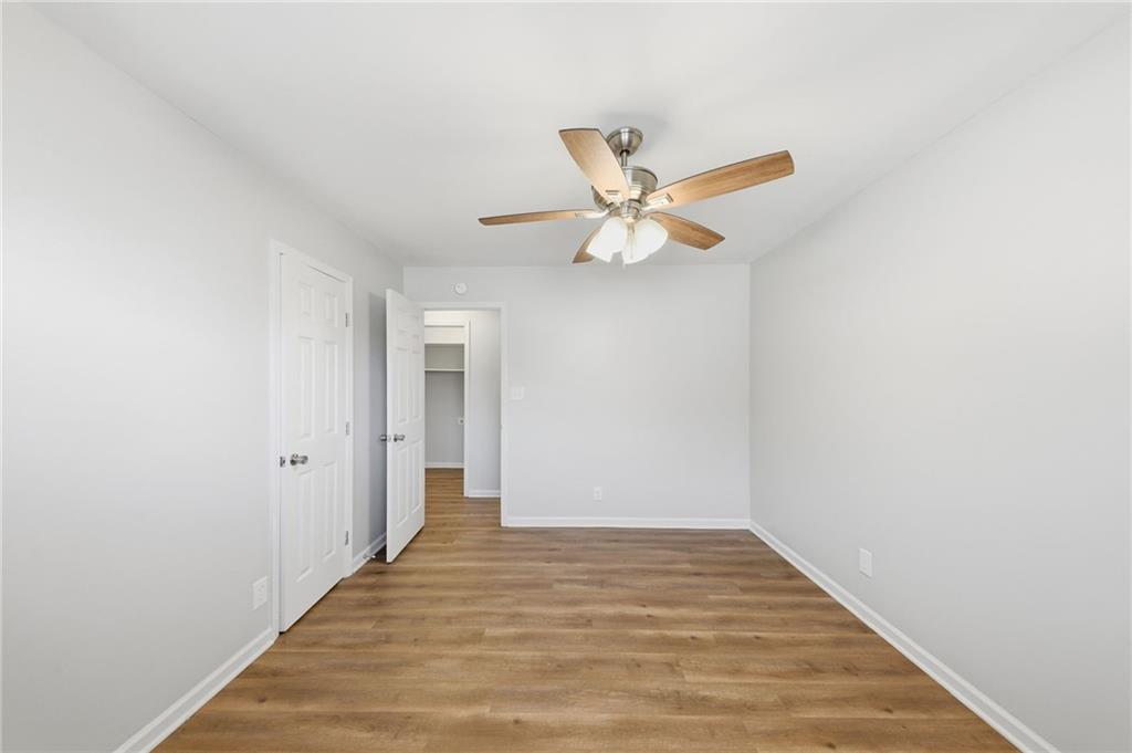 2086 Fairburn Road Southwest Atlanta, GA 30331 - Photo 16 of 28 a view of a hallway with wooden floor