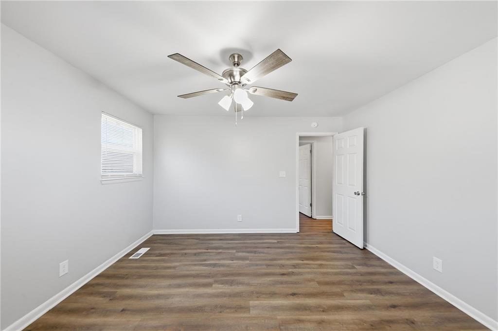 2086 Fairburn Road Southwest Atlanta, GA 30331 - Photo 18 of 28 a view of an empty room with a fan