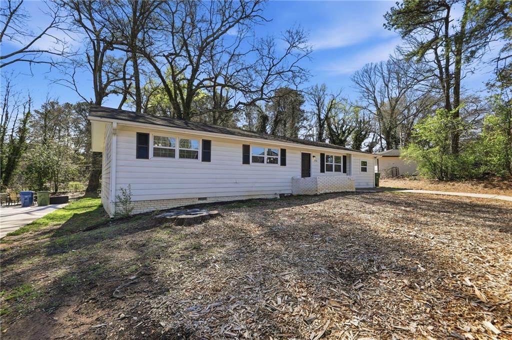 2086 Fairburn Road Southwest Atlanta, GA 30331 - Photo 3 of 28 a view of a house with a yard