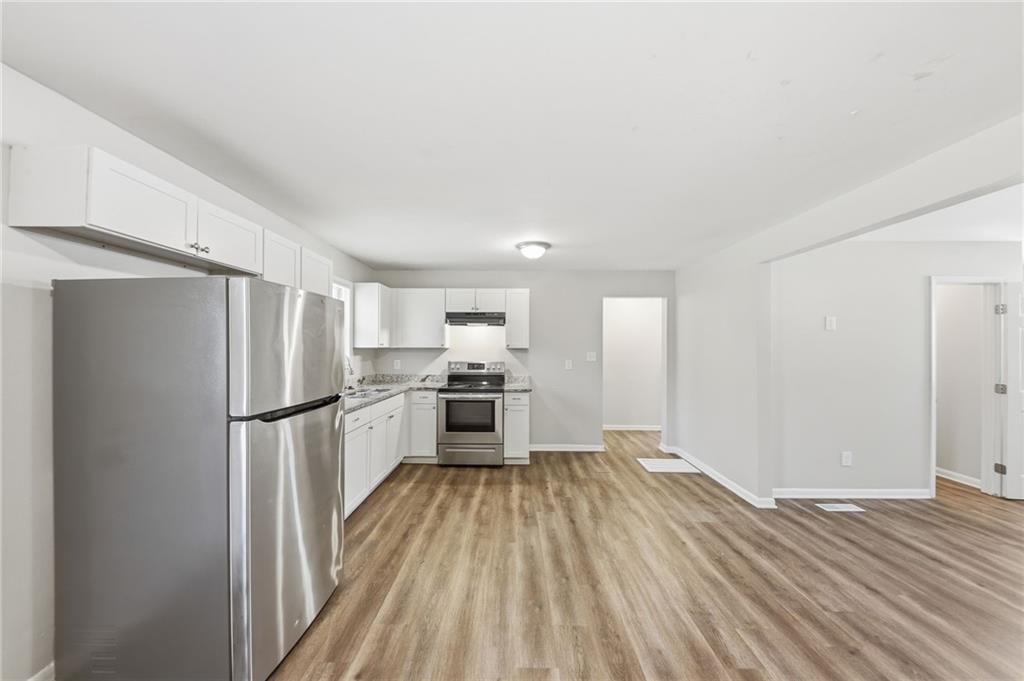 2086 Fairburn Road Southwest Atlanta, GA 30331 - Photo 8 of 28 a view of kitchen with wooden floor