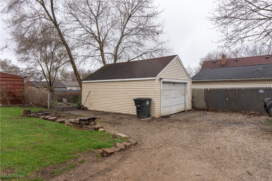 918 Brittain Road Akron, OH 44305 - Photo 3 of 3 Detached garage with driveway and fence