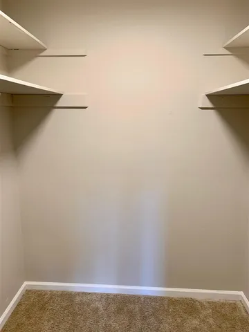 a view of small space with racks on the wall