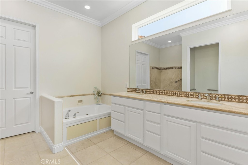 5233 Hampton Road Banning, CA 92220 - Photo 25 of 46 a bathroom with a sink and a mirror