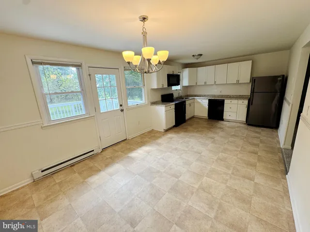 a view of a kitchen with a sink and dishwasher kitchen view