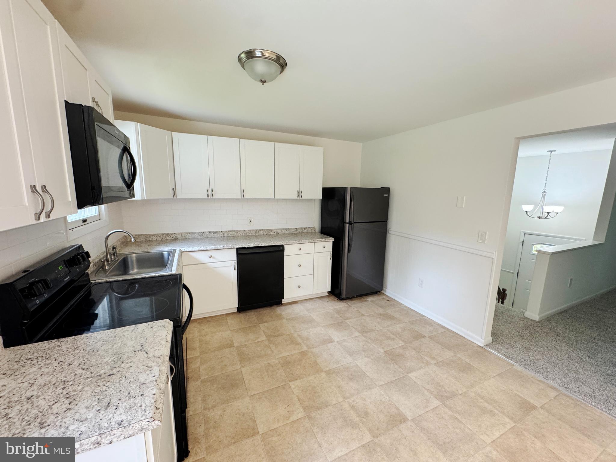 154 Niantic Road Barto, PA 19504 - Photo 22 of 33 a kitchen with a stove a refrigerator and a sink