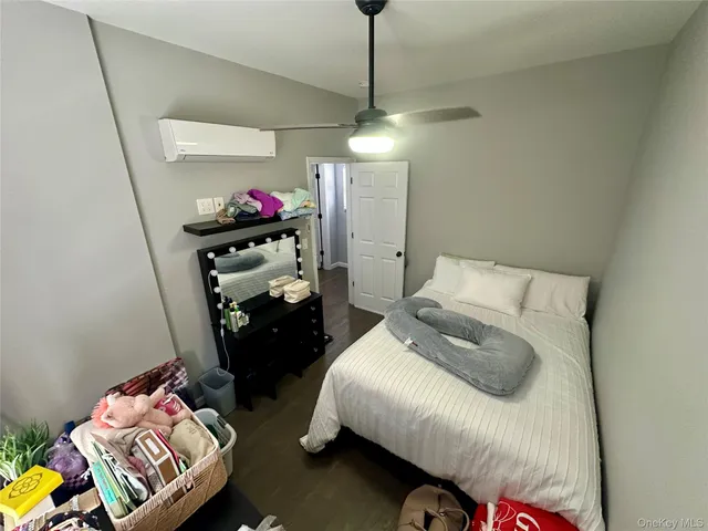 a bed room with a bed window and a couch